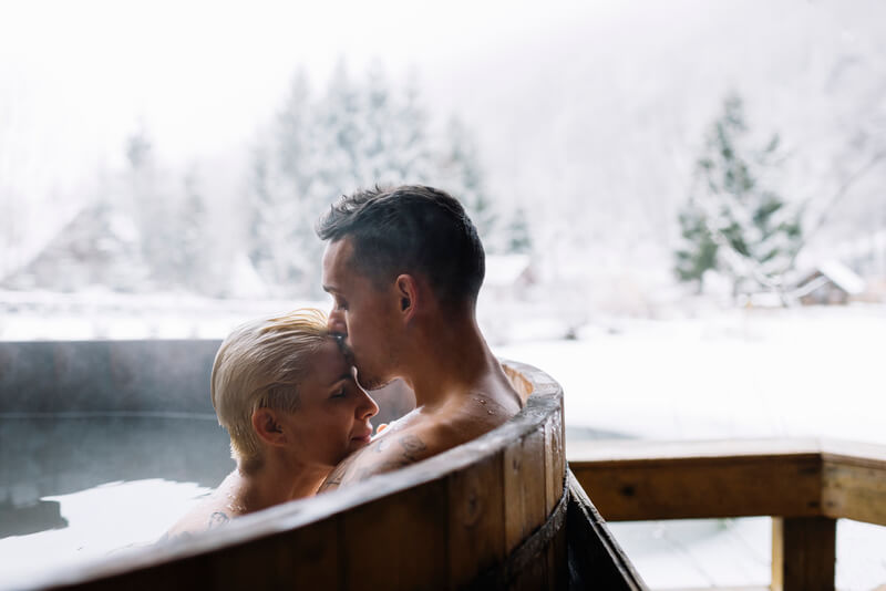 winter hot tubbing couple